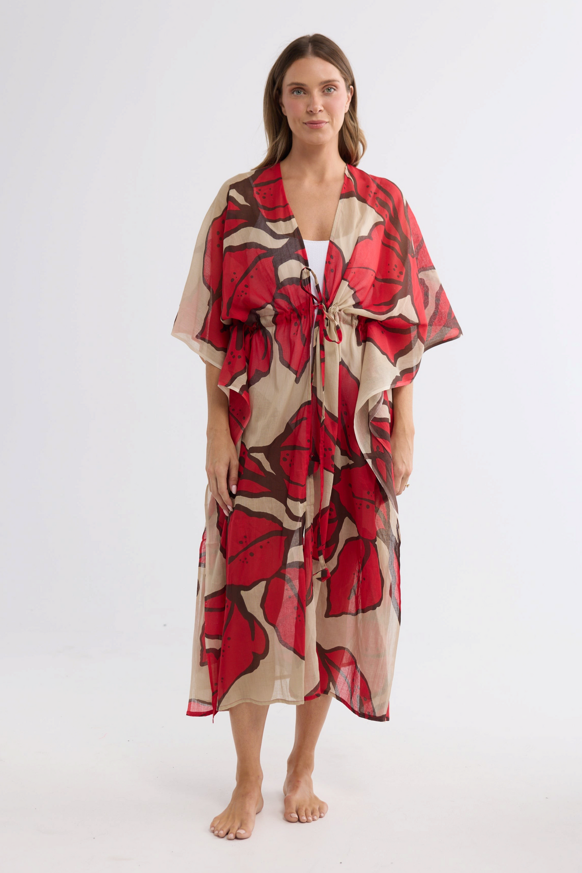 ELSHAM BOUTIQUE Asta long cotton kaftan in crimson floral print with an adjustable waist tie on a model