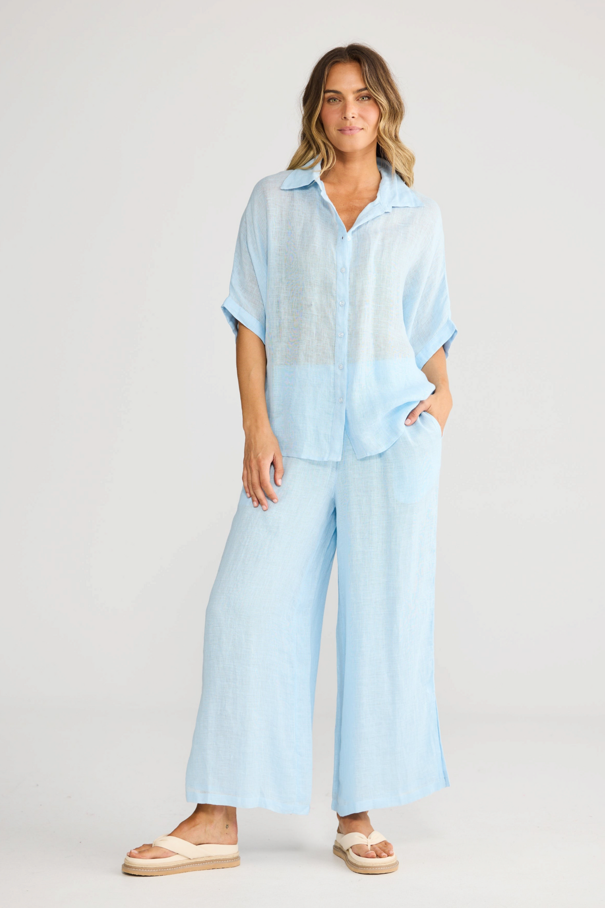 ELSHAM BOUTIQUE light blue linen shirt with a relaxed oversized fit, collared neckline, and button-front closure.
