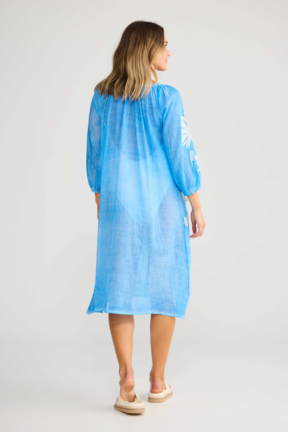 ELSHAM BOUTIQUE blue cotton knee-length dress with three-quarter sleeves and white embroidery, back view