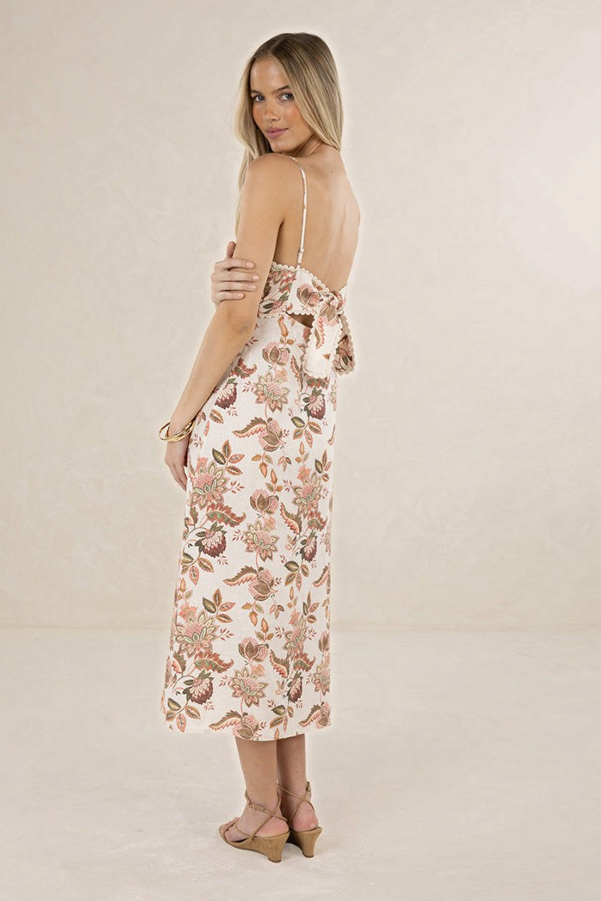 ELSHAM BOUTIQUE Bohemian Rose linen midi dress with strappy open back and scalloped trim, worn by a blonde model.