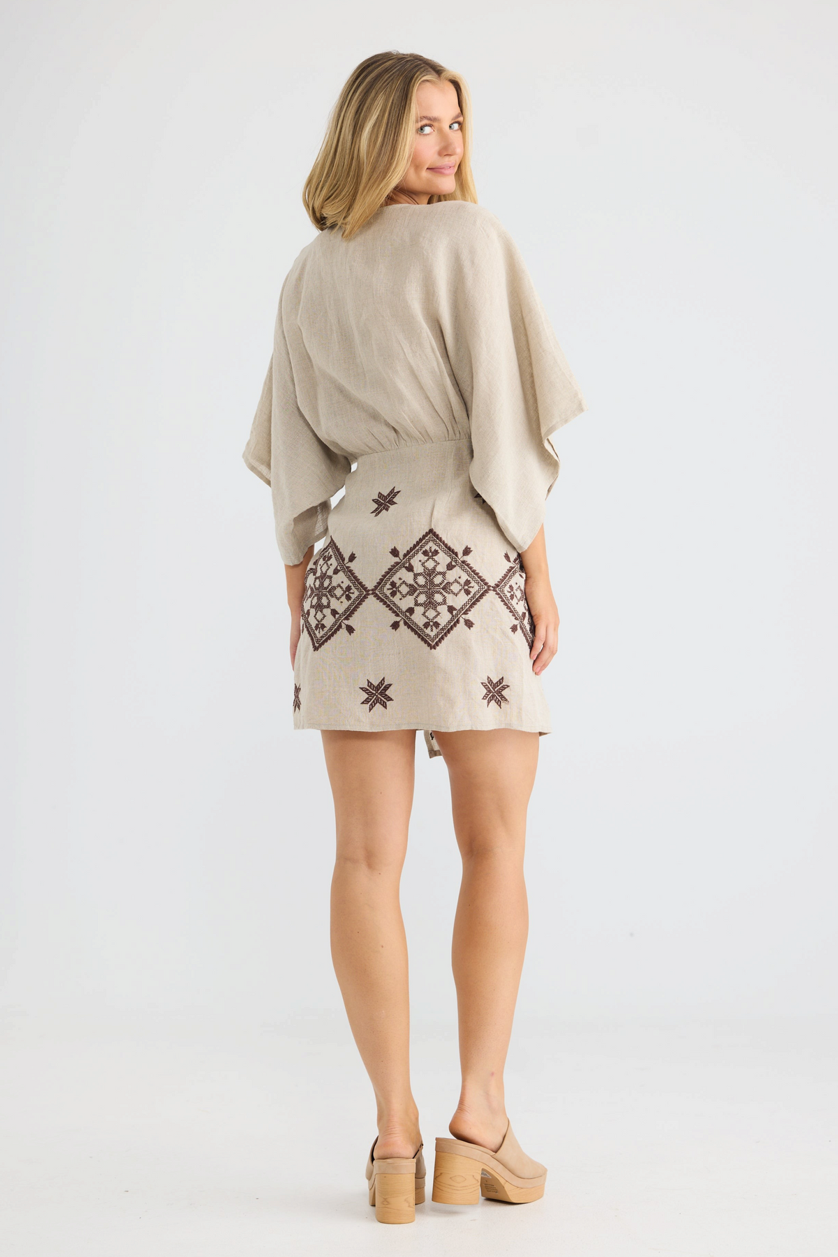 ELSHAM BOUTIQUE natural linen wrap dress with kimono sleeves and brown geometric embroidery, back view