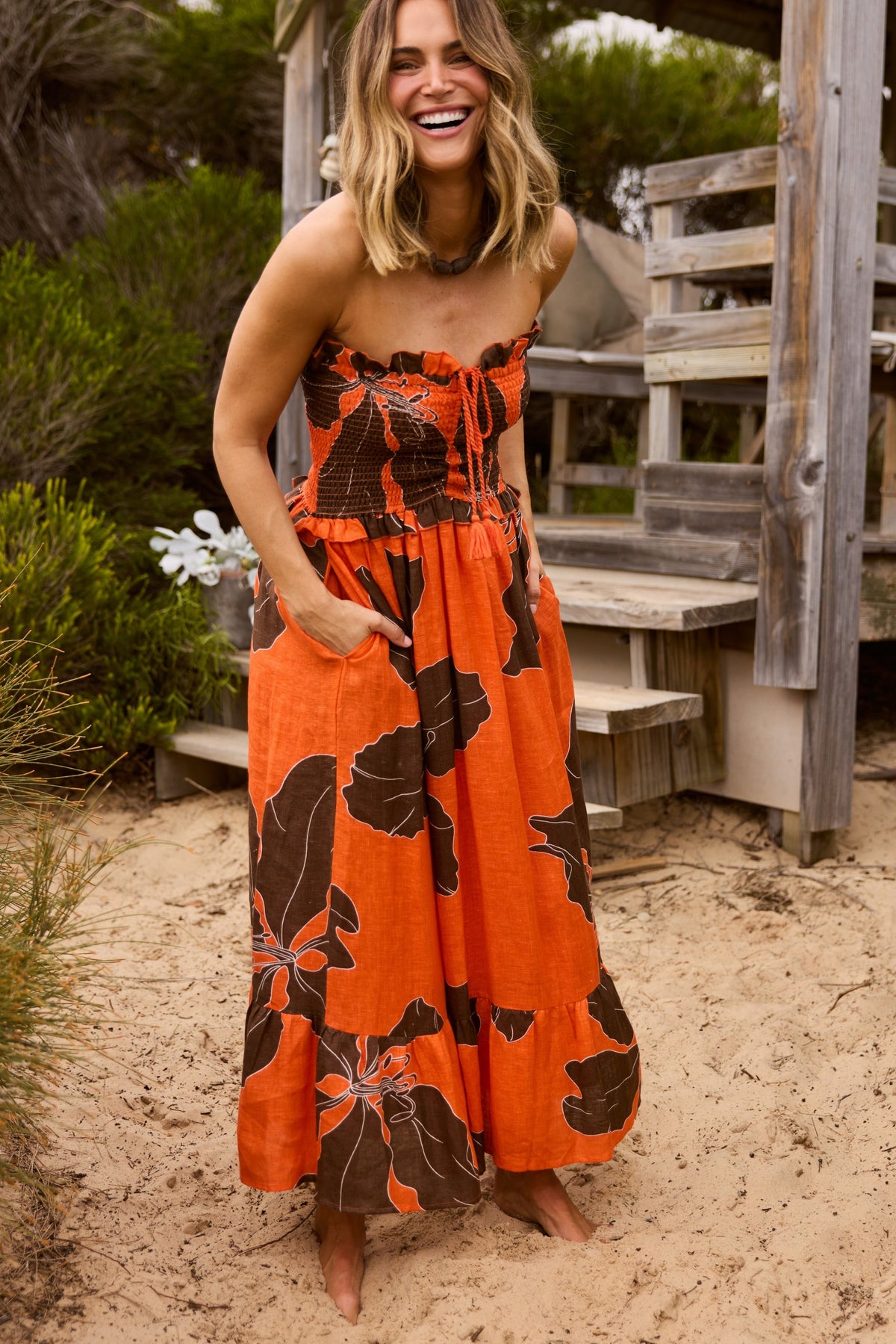 ELSHAM BOUTIQUE Sorrel strapless linen midi dress in hibiscus orange with brown floral print and front ruching