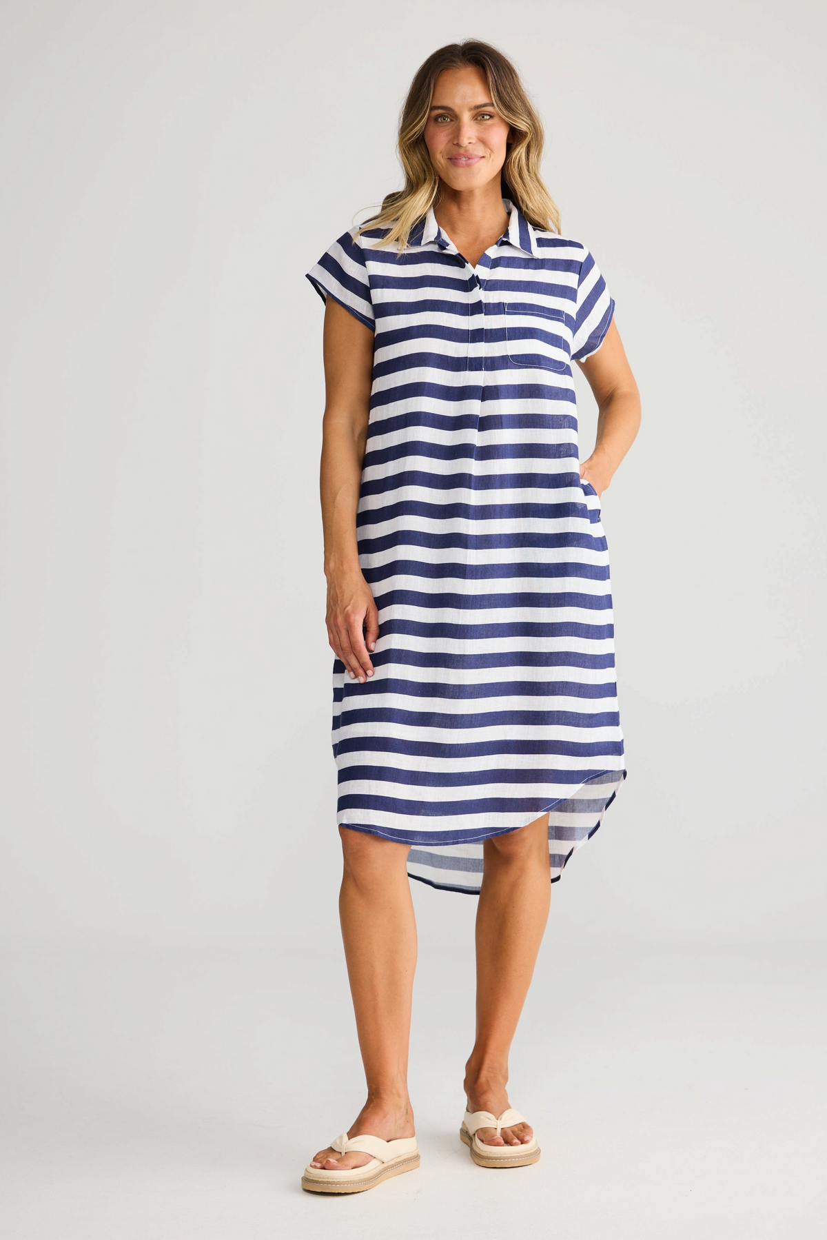 ELSHAM BOUTIQUE navy and white striped cotton tunic dress with collared neckline, cap sleeves, and hi-lo hemline.