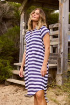 ELSHAM BOUTIQUE navy and white striped cotton tunic with a collared neckline, cap sleeves, and a hi-lo hemline.