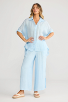 ELSHAM BOUTIQUE light blue linen oversized collared shirt and matching wide-leg trousers on a model