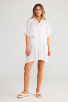 ELSHAM BOUTIQUE white cotton Halia shirt kaftan with short sleeves, button front, and gold starburst embroidery.