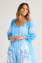 ELSHAM BOUTIQUE blue cotton knee-length Aloha dress with white floral embroidery, three-quarter sleeves, and front tie