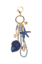 ELSHAM BOUTIQUE blue starfish keyring with shell and bead charms on a gold-tone metal clip