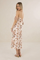 ELSHAM BOUTIQUE Bohemian Rose linen midi dress with strappy open back and scalloped trim, worn by a blonde model.