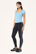 ELSHAM BOUTIQUE Alaskan Blue scoop neck short sleeve top worn with black leggings by a model