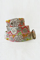 ELSHAM BOUTIQUE wool belt featuring vibrant floral embroidery in pink, green, and grey with a metal buckle.