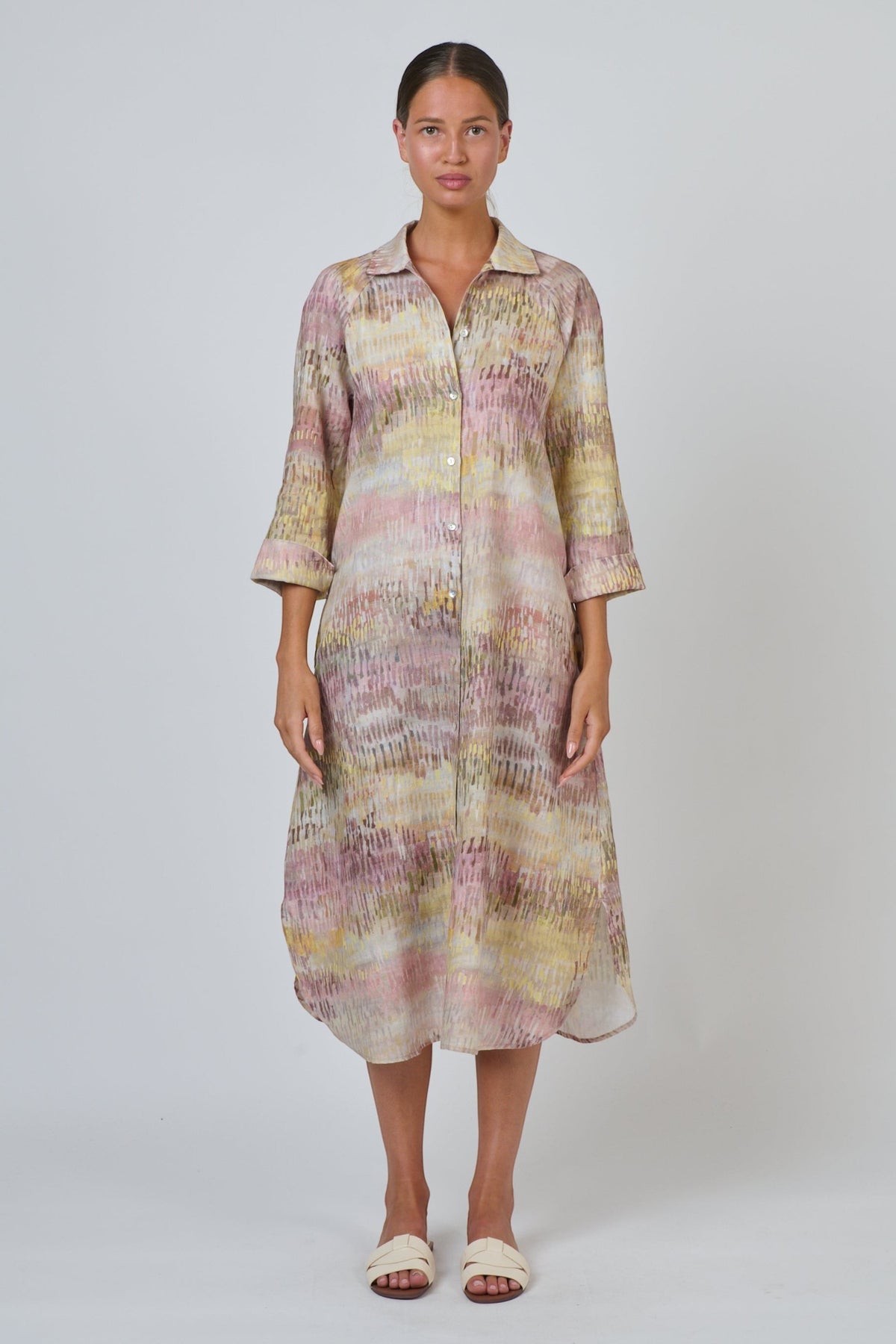 ELSHAM BOUTIQUE midi shirt dress in Jardin print linen with point collar, button front, and high-low hem on a model.