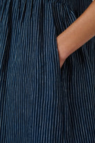 ELSHAM BOUTIQUE navy blue pinstriped linen midi dress featuring a functional side seam pocket detail