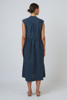 ELSHAM BOUTIQUE navy pinstripe linen midi dress with cap sleeves, drop waist, and back yoke detail, back view.