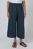 ELSHAM BOUTIQUE navy pinstripe linen wide-leg cropped pants with an elastic waistband and front pockets.