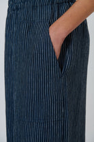 ELSHAM BOUTIQUE navy blue pinstripe linen wide leg cropped pants with an elasticated waist and oversized side pocket