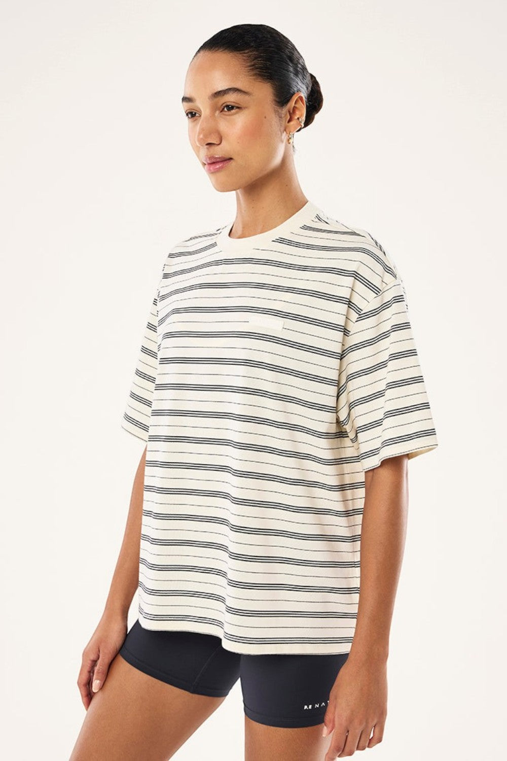 ELSHAM BOUTIQUE oversized white t-shirt with thin black horizontal stripes and a small chest branding patch