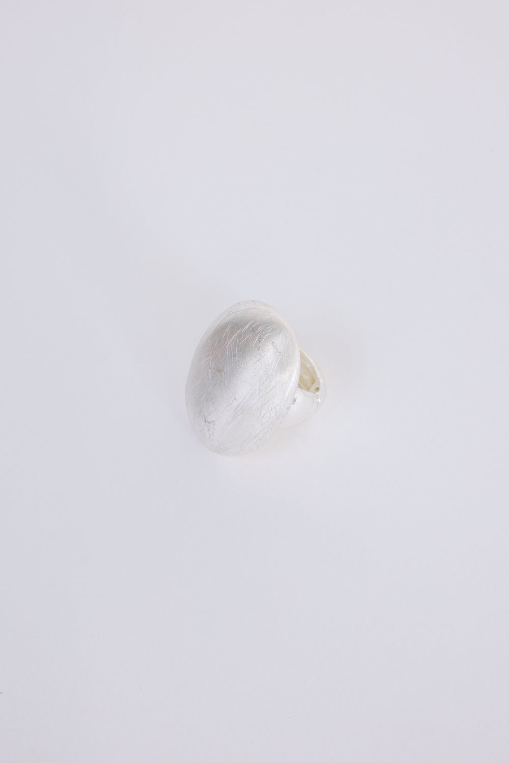 ELSHAM BOUTIQUE Nola Ring: silver statement ring with smooth domed face and brushed texture finish, modern sculptural design.