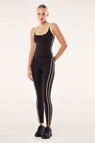 ELSHAM BOUTIQUE Solis Scoop Tank in black bean and soft yellow with contrast straps on a model wearing matching leggings