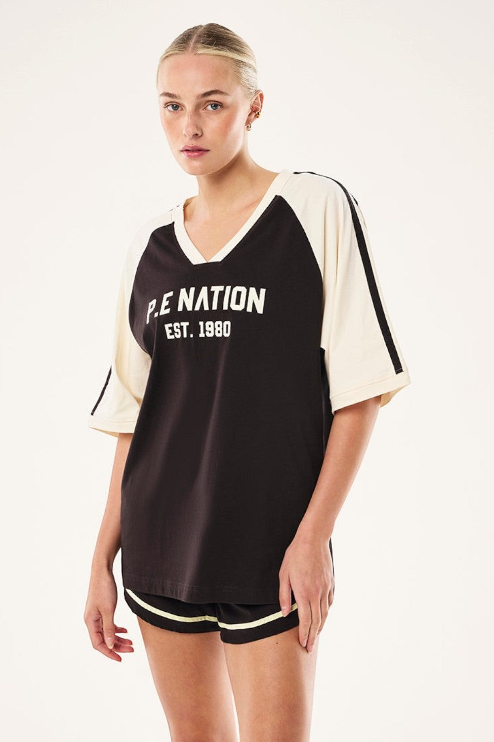 ELSHAM BOUTIQUE Spinout baseball tee in black and whisper white organic cotton with graphic print and contrast binding