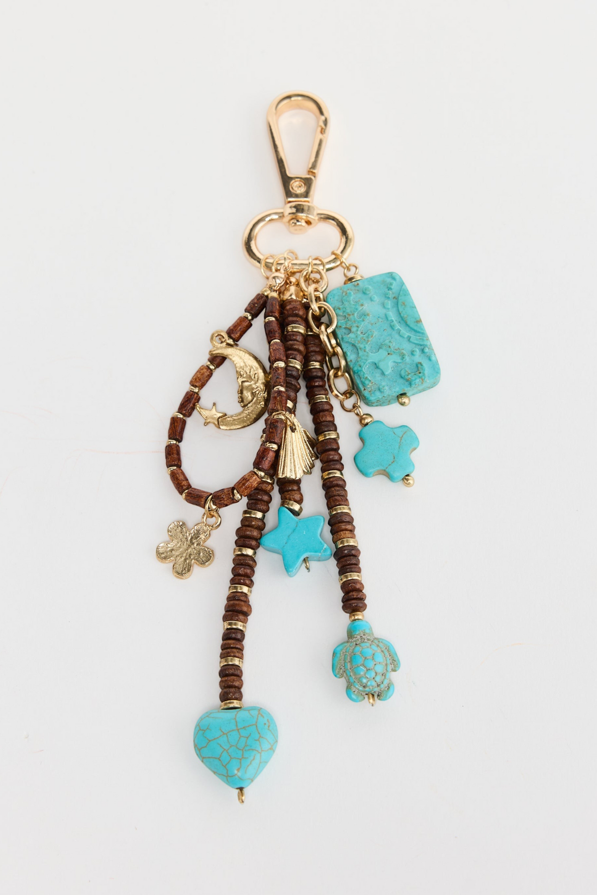 ELSHAM BOUTIQUE Wild West keyring featuring turquoise-look charms, wooden beads, and gold-tone metal accents.